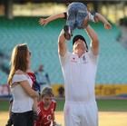 Flintoff celebrates with his wife and holds aloft one of his children at the Oval